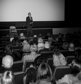 Journalist Andrew Rosenthal speaking to an auditorium audience