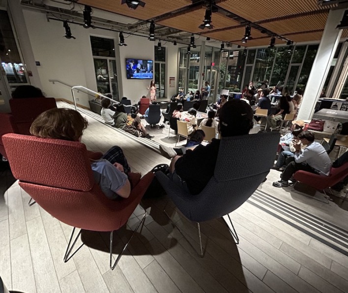 Students in the Starbucks cafe at the presidential debate watch party in 2024