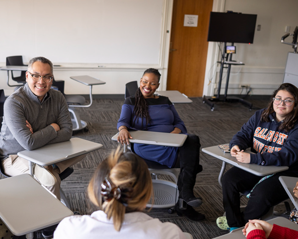 Students in a study group with professor