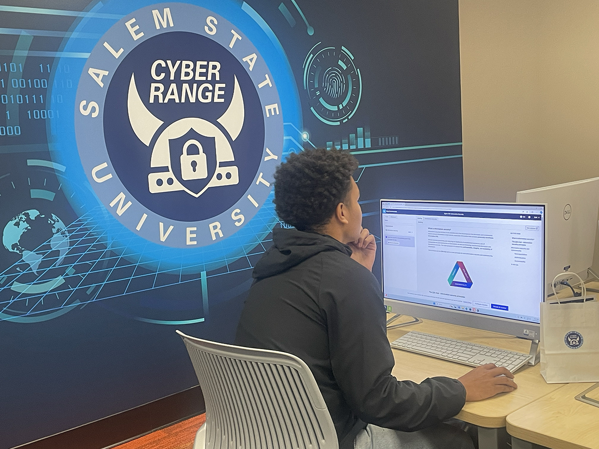 A student at a workstation in Salem State's Cyber Range