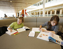 Two female students study in the Berry Library