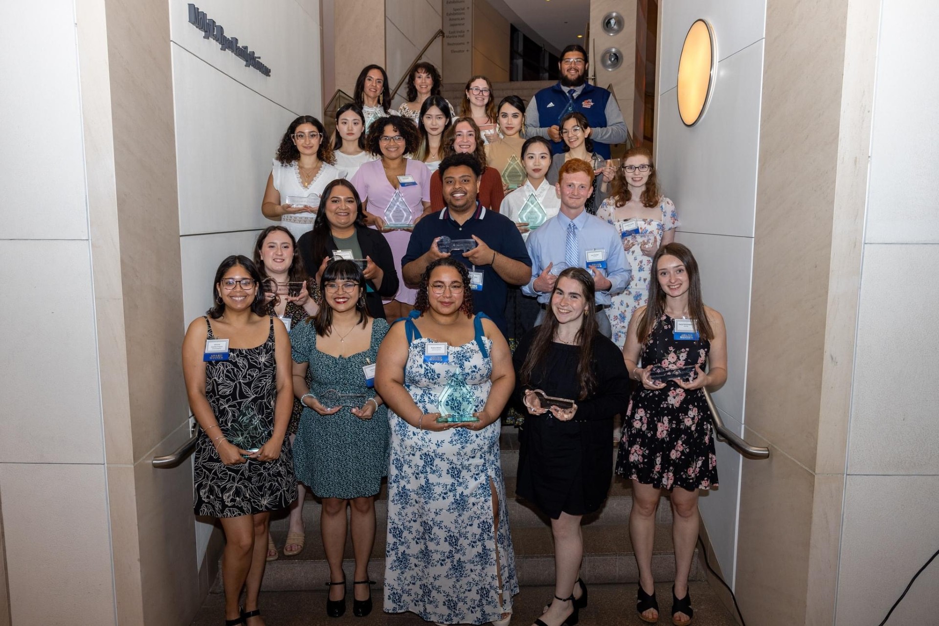 Student Award Winners pose on the steps during Senior Week