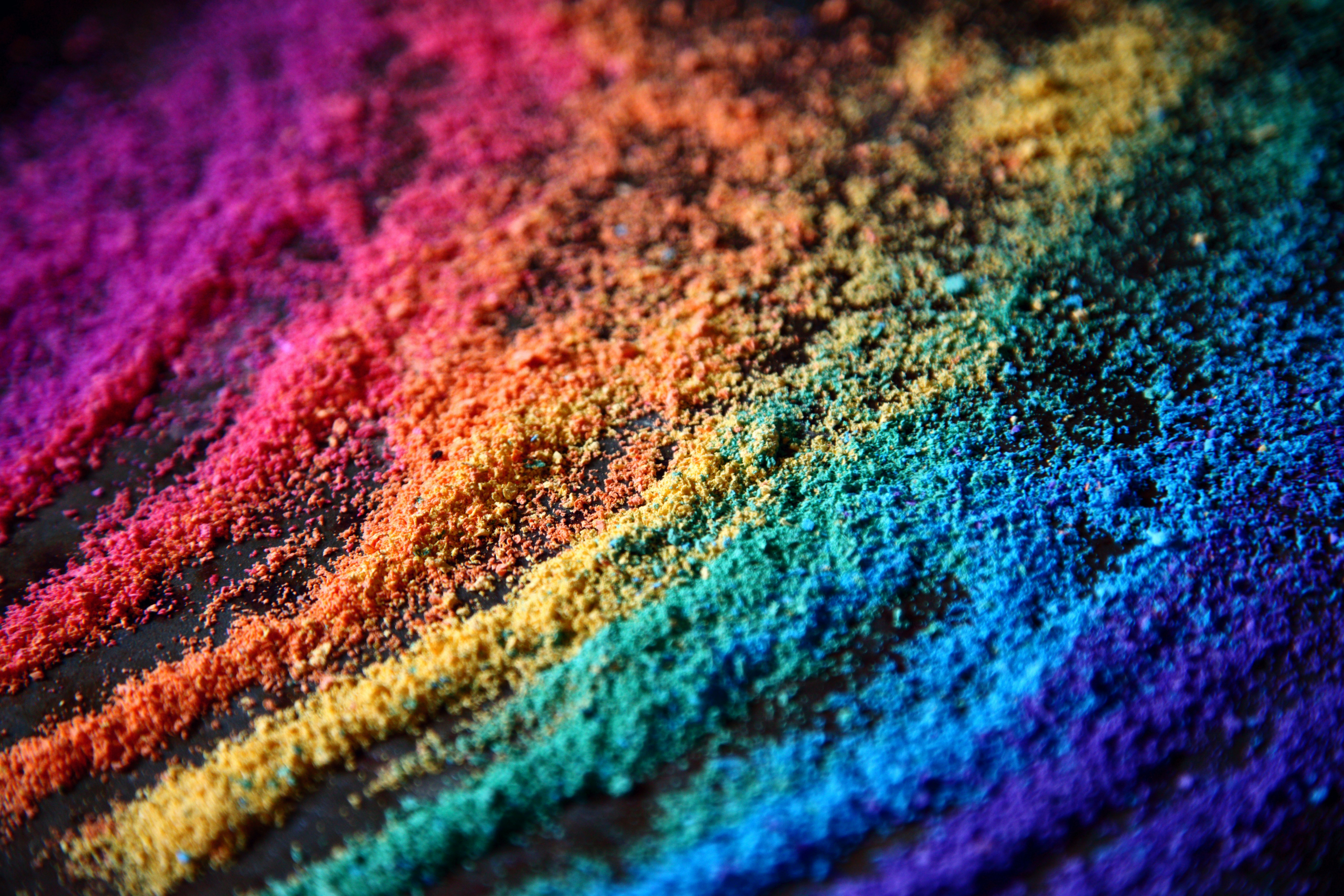 colored sand strewn in layers making a rainbow effect