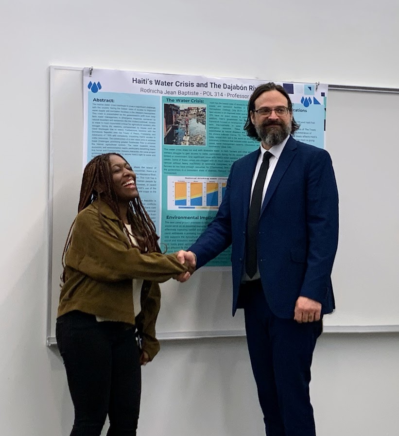 Rodnicha Jean Baptiste is congratulated by Professor Guy Bellino, Earth Days Pl…