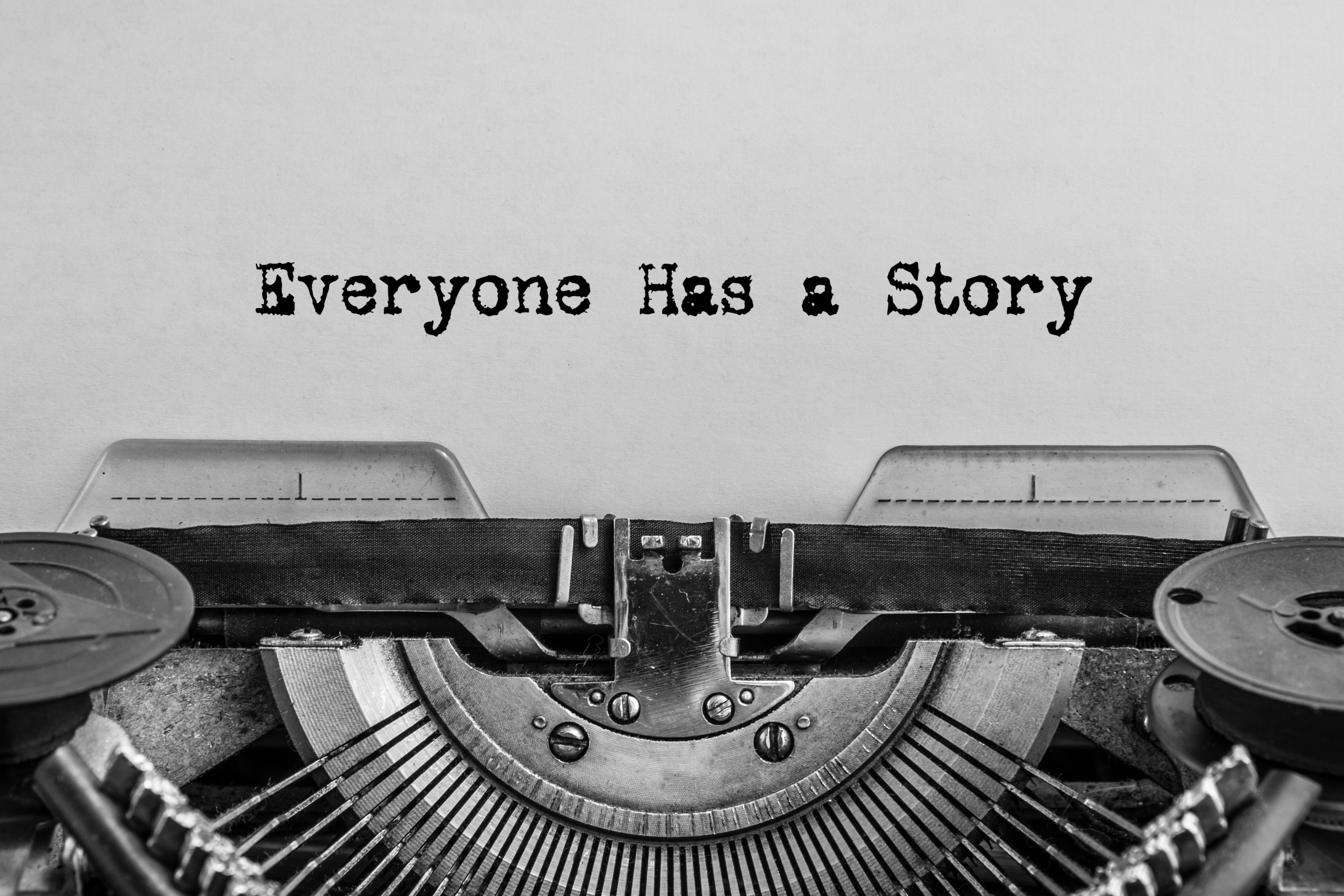 Paper in a typewriter with text Everyone Has A Story