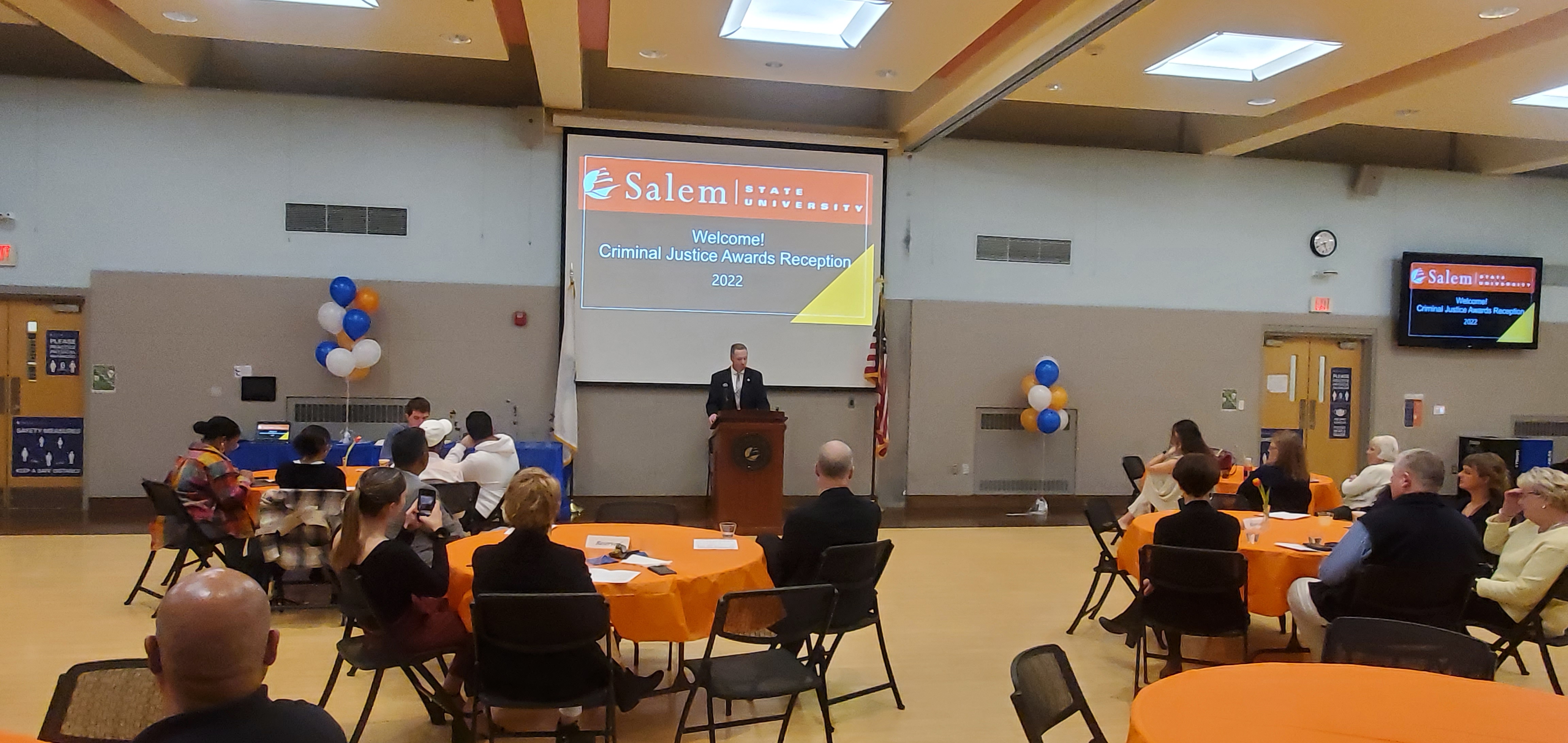 Paul Tucker speaks to a room of award-winning criminal justice students at Salem State.