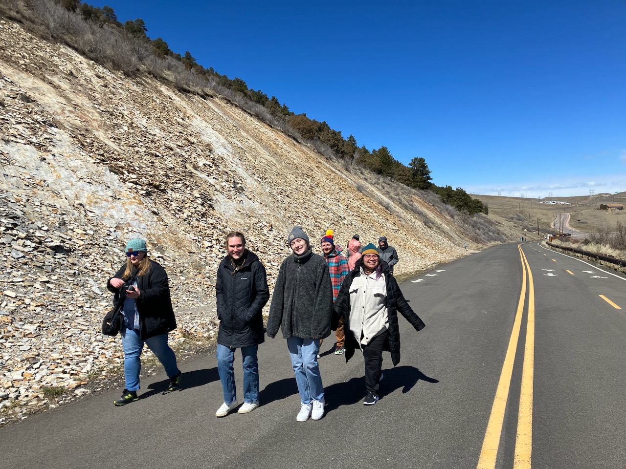 Geography and sustainability students touring fossil beds at Dinosaur Ridge jus…