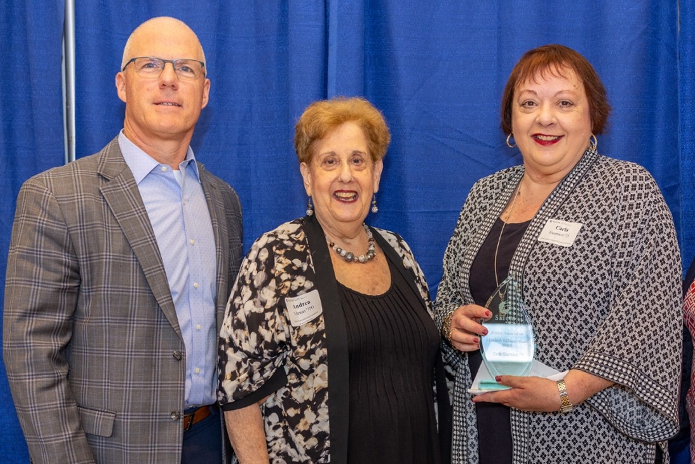 Pictured above: President John D. Keenan; Andrea C. Liftman '75G, Salem State University Alumni Association and Foundation; and Carla Guarnieri ’75