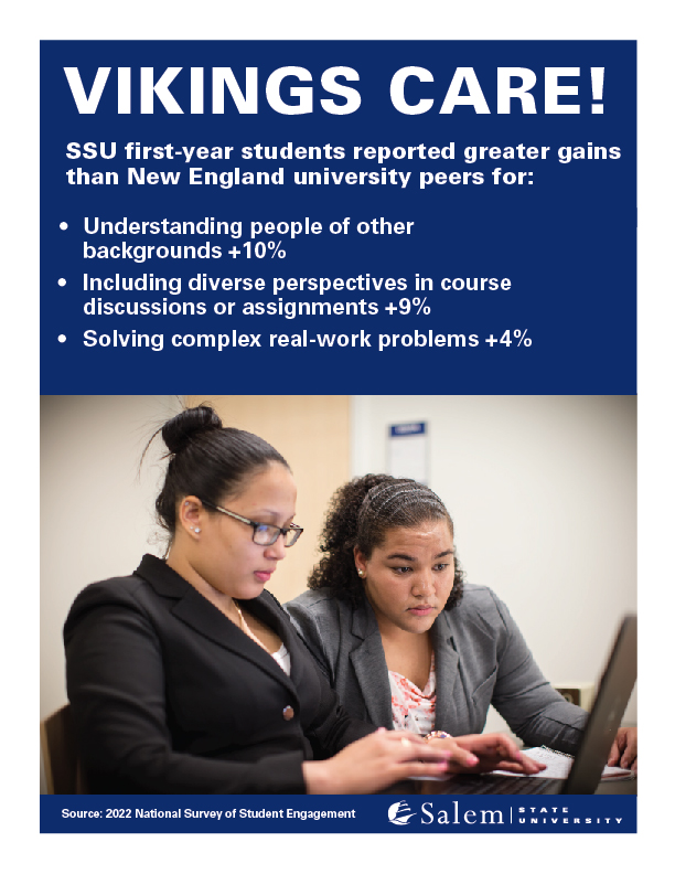 Photo of two students working from a laptop with first-year student results fro…