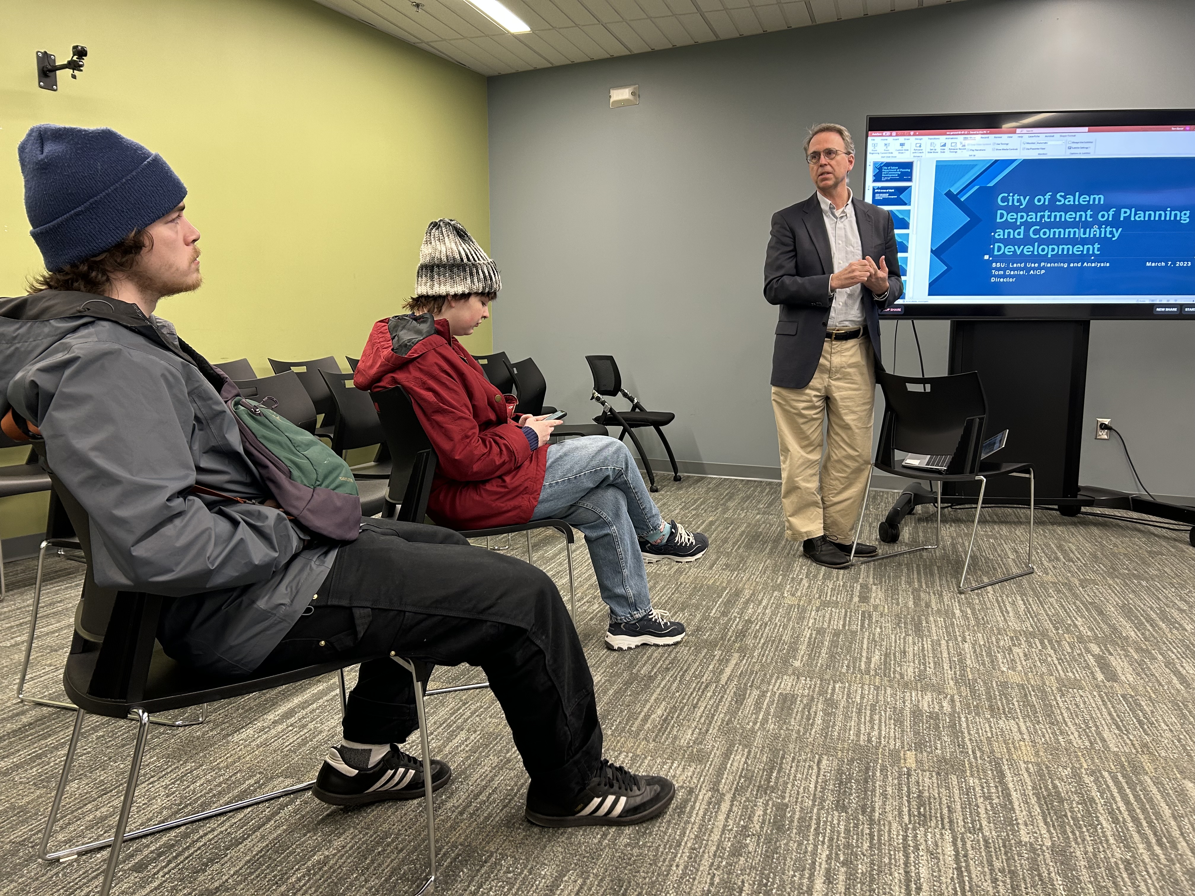 Salem City Planner Tom Daniels talks to geography and sustainability students a…