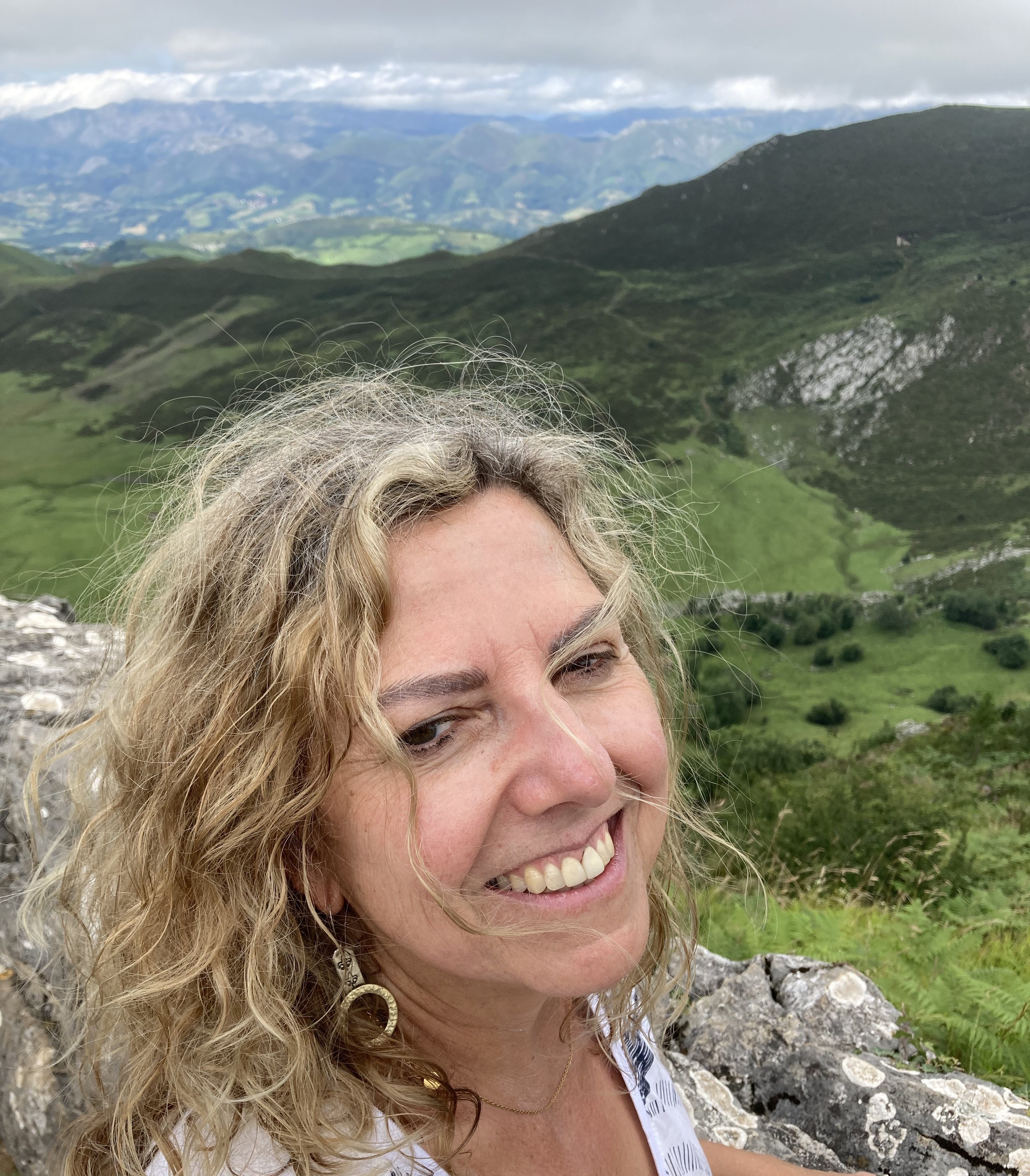 Fatima Serra headshot standing before a vista