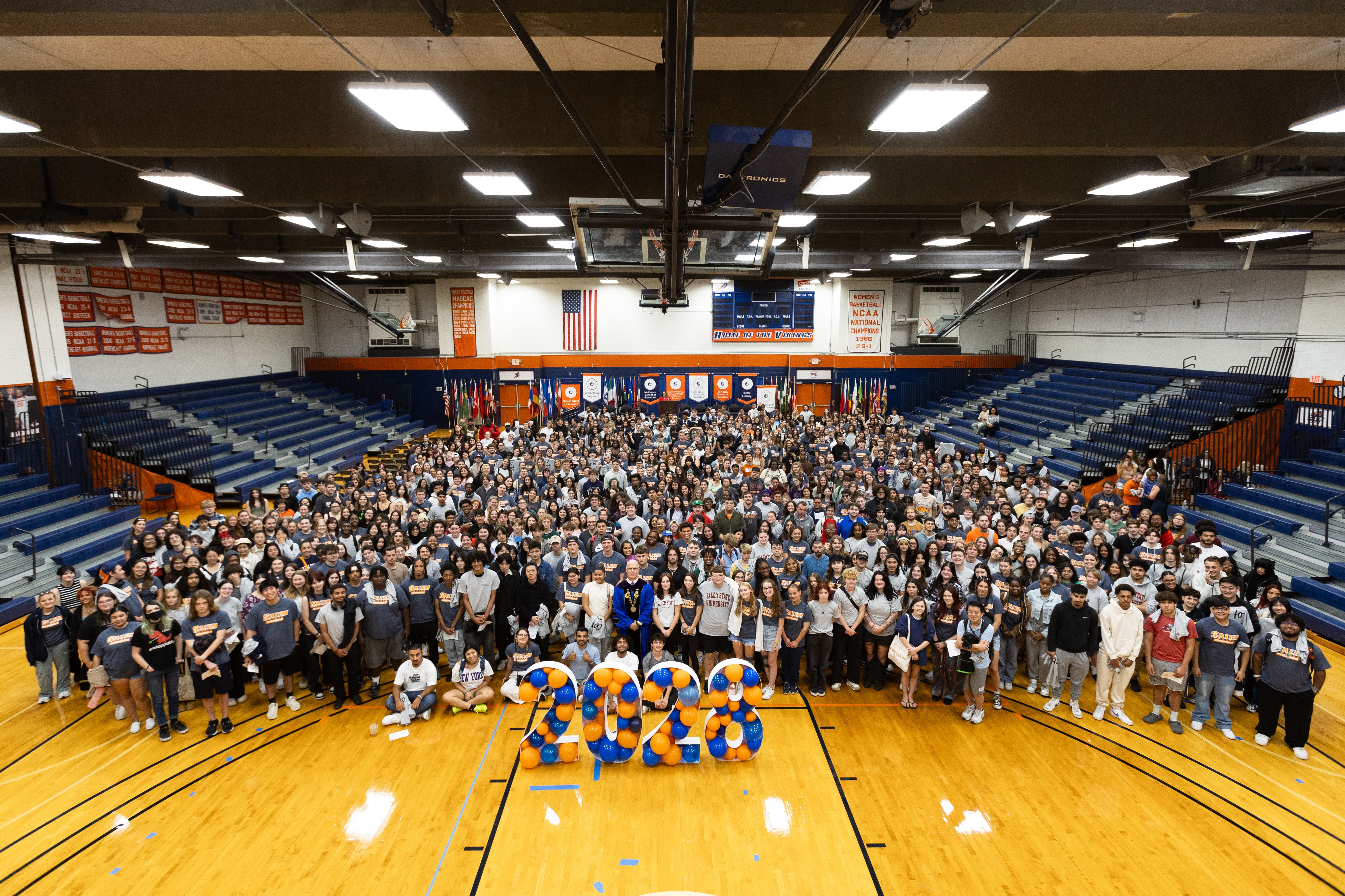 Class of 2028 photo - students crowded together in the gym