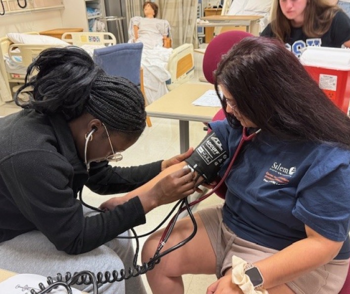 Student nurses screen blood pressure