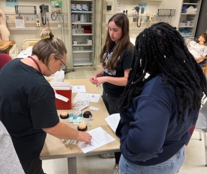 Students receive instruction on how to apply injections