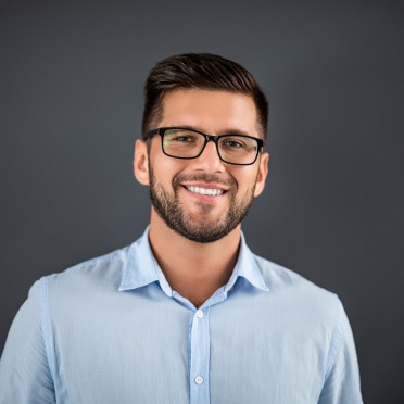 A young man in glasses headshot