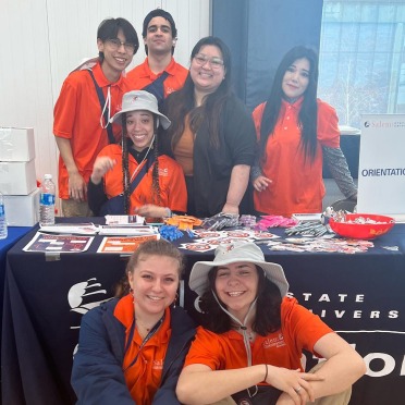 Orientation leaders and staff at a table