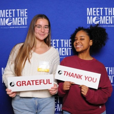 Scholars at the 2024 scholar and donor celebration with fun signs