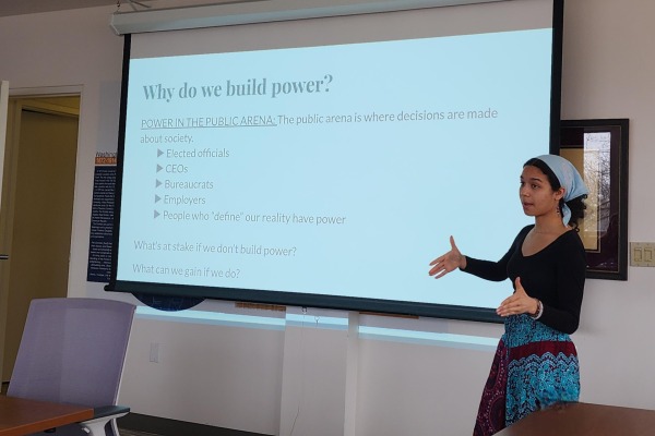 Student presenting at the front of a room