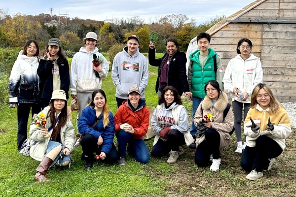 Salem State students at a farm volunteering for Service Saturday