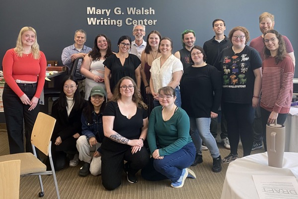 A group of students and faculty in the Mary G. Walsh Writing Center at Salem State
