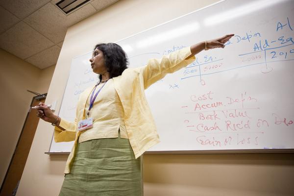 professor standing in front of whiteboard