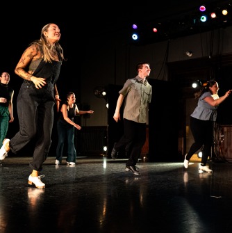 four people tap dancing